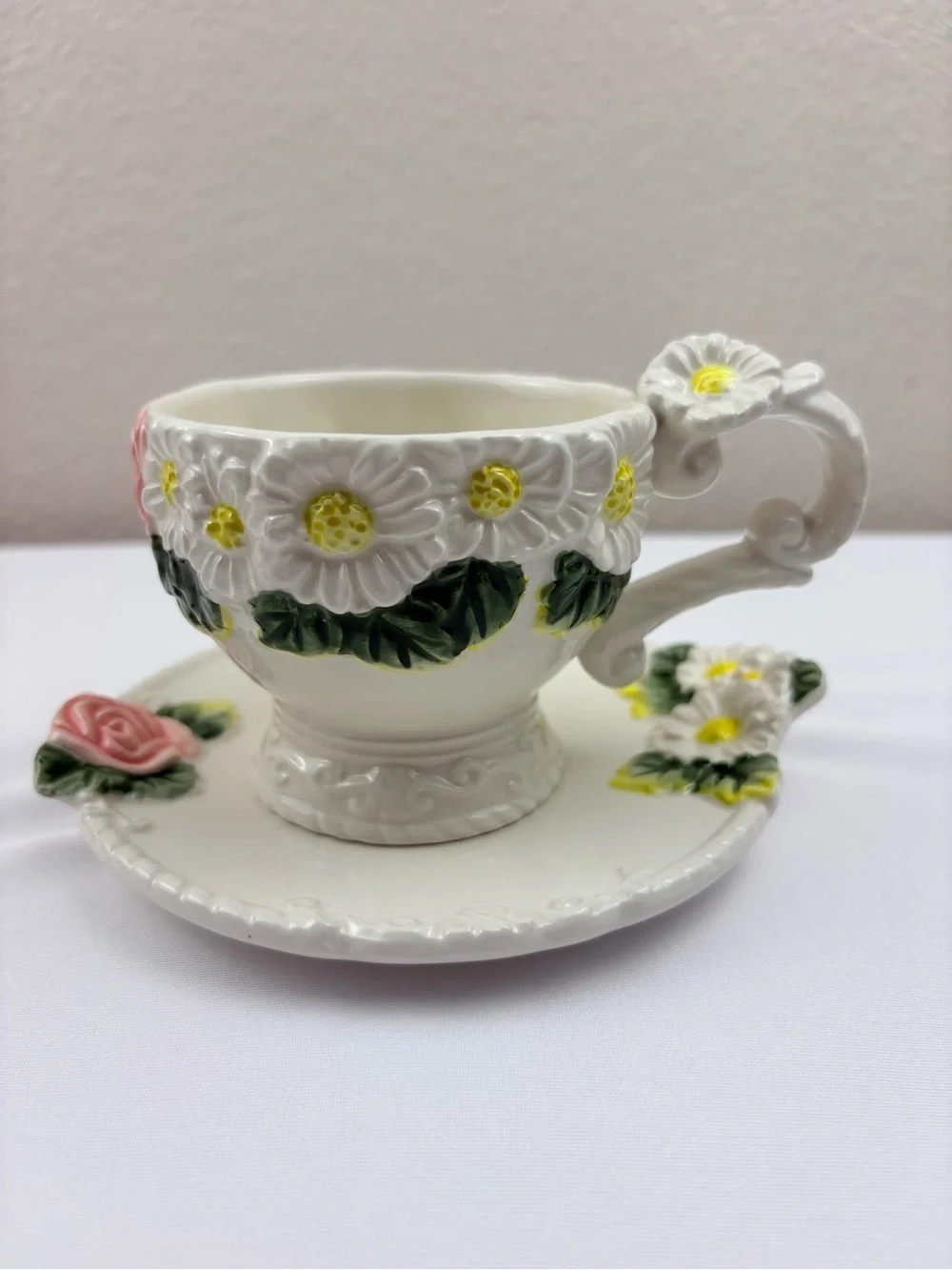 White Teacup & Saucer Featuring Ceramic Base, Raised White Daisies & Pink Roses